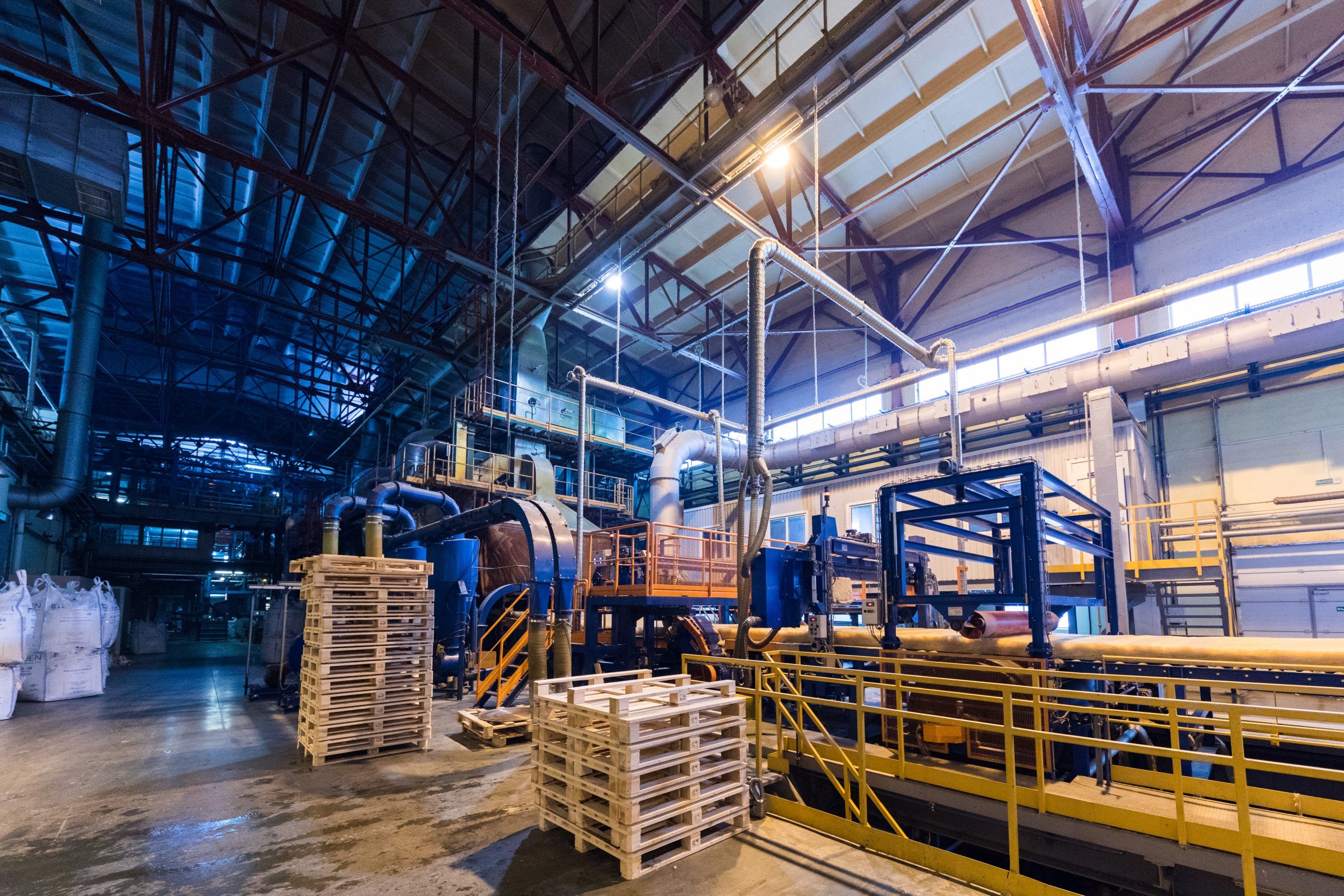 Fiberglass production industry equipment at manufacture background